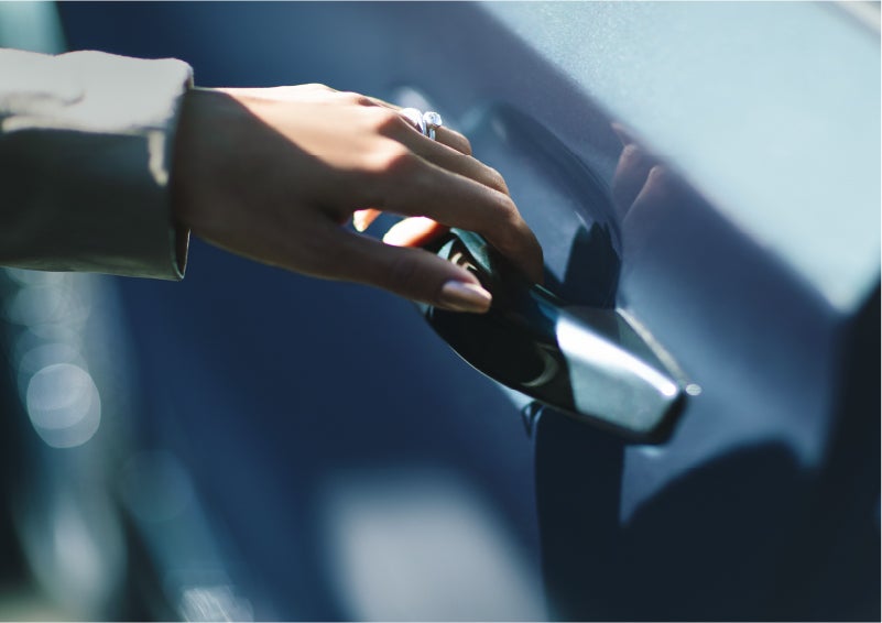 A hand gracefully grips the Light Touch Handle of a 2023 Lincoln Aviator® SUV to demonstrate its ease of use | Boulevard Lincoln in Millsboro DE