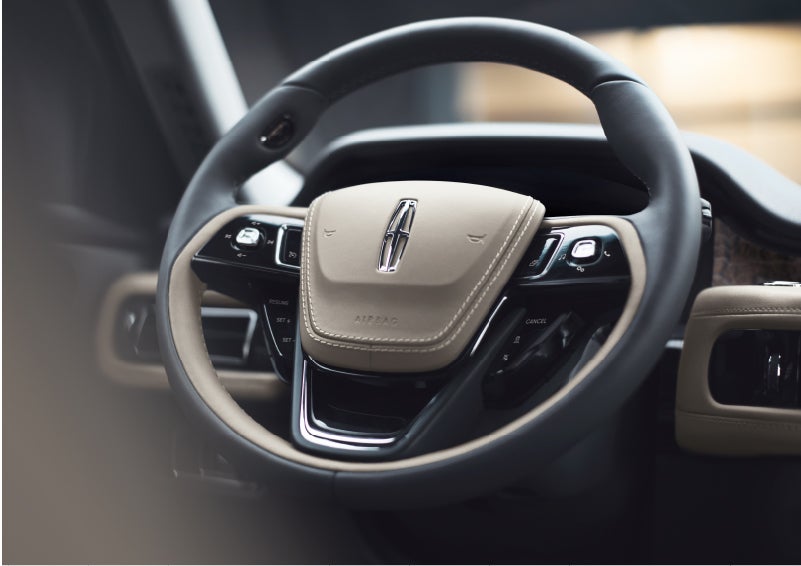 The intuitively placed controls of the steering wheel on a 2023 Lincoln Aviator® SUV | Boulevard Lincoln in Millsboro DE