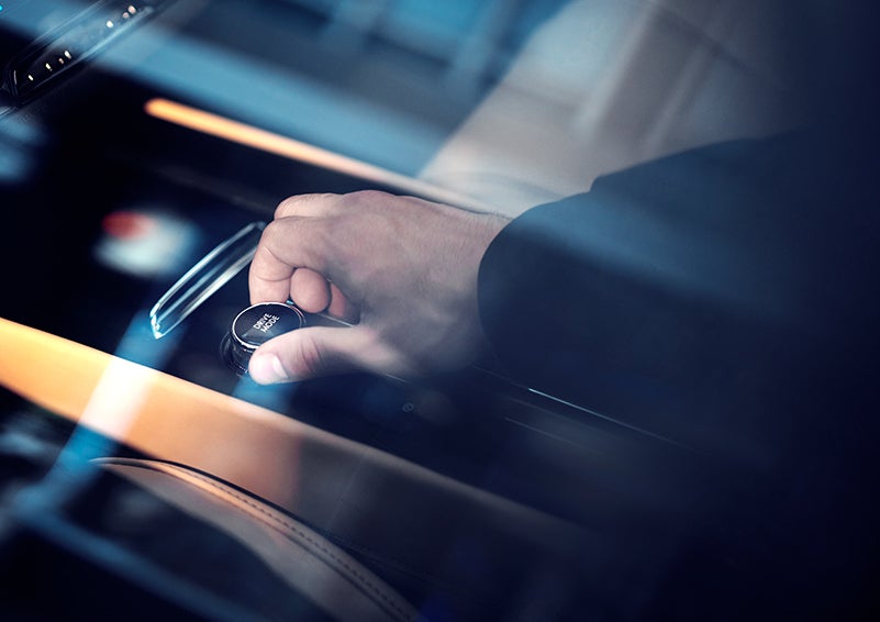 The driver of a 2023 Lincoln Corsair® SUV is shown adjusting the drive mode. | Boulevard Lincoln in Millsboro DE