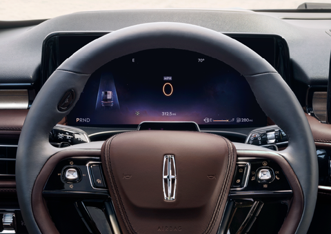 The steering wheel of 2025 Lincoln Aviator® SUV is shown with black and brown accents. | Boulevard Lincoln in Millsboro DE