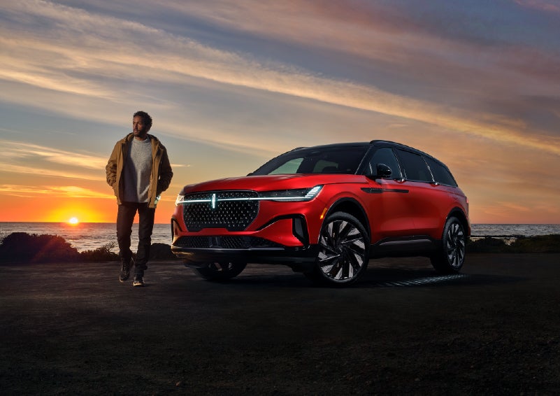A person is shown next to a 2025 Lincoln Nautilus® SUV as the Lincoln Embrace sequence takes place. | Boulevard Lincoln in Millsboro DE