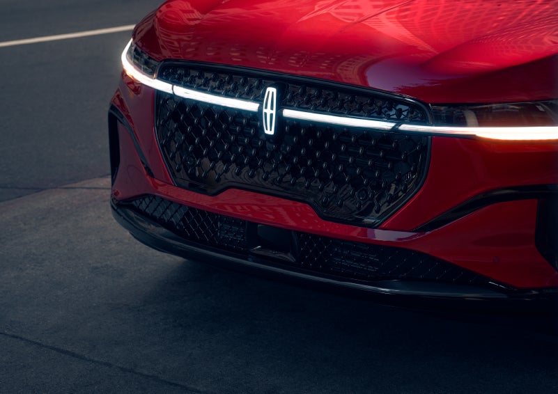 The available front LED light bar and center Lincoln Star logo glow at dusk. | Boulevard Lincoln in Millsboro DE