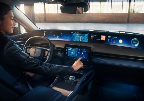 The driver of a 2025 Lincoln Nautilus® SUV interacts with the center touchscreen. | Boulevard Lincoln in Millsboro DE