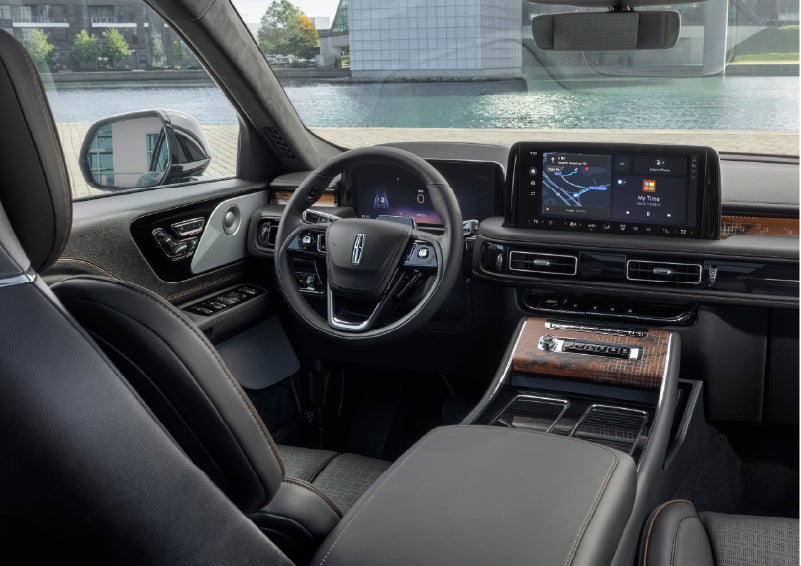 The interior of the 2026 Lincoln Aviator® SUV is shown parked with a view of a harbor through the windshield. | Boulevard Lincoln in Millsboro DE