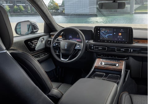 The interior of the 2026 Lincoln Aviator® SUV is shown parked with a view of a harbor through the windshield. | Boulevard Lincoln in Millsboro DE