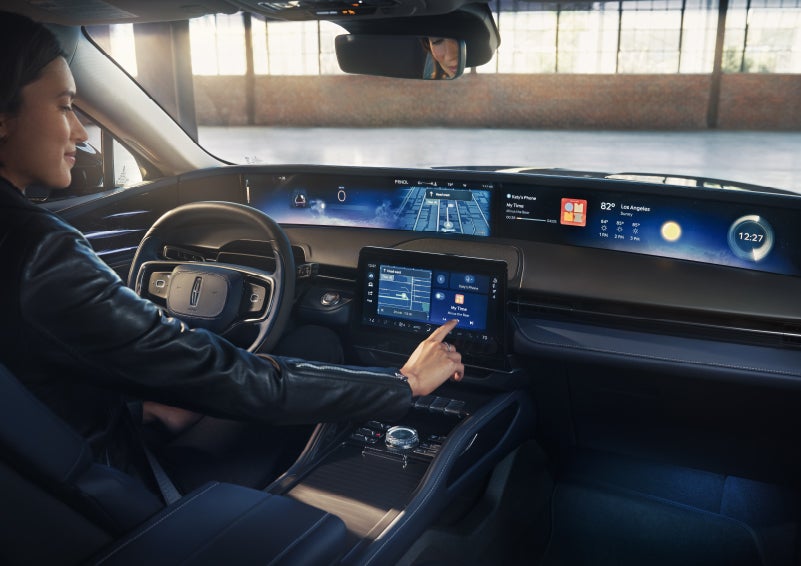 The driver of a 2026 Lincoln Nautilus® SUV interacts with the center touchscreen. | Boulevard Lincoln in Millsboro DE