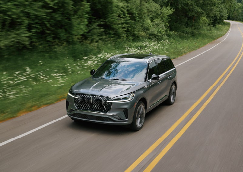 A 2027 Lincoln Aviator® SUV is being driven down a road. | Boulevard Lincoln in Millsboro DE