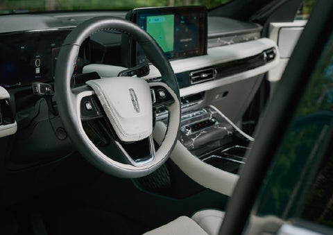 The leather-trimmed steering wheel of a 2027 Lincoln Aviator® Black Label™ SUV. | Boulevard Lincoln in Millsboro DE