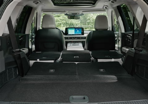 A rear to front view of the interior of a 2027 Lincoln Aviator® Black Label™ SUV shows the third and second rows folded flat | Boulevard Lincoln in Millsboro DE